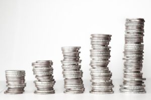 Ascending in height stacks of silver coins